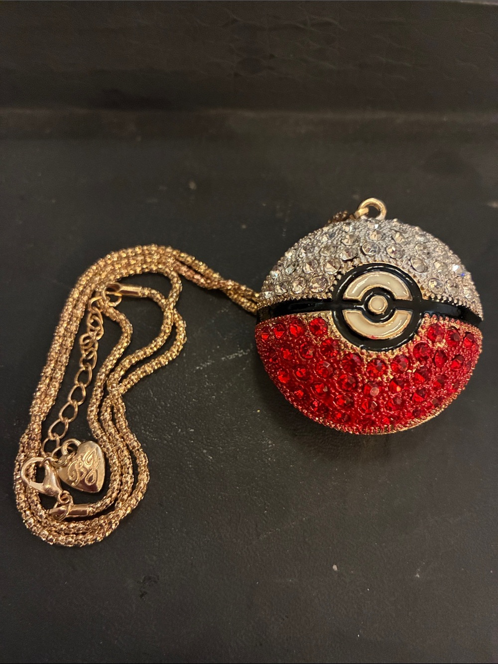 Crystal Poké Ball Red & Silver this pendant comes on a 17”chain with 3”extender.